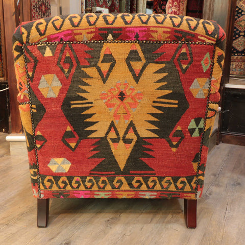 Howard style chair covered in old Turkish kilim in red and tan colours jenningsrugs